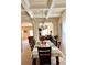 Elegant dining room featuring coffered ceilings, a chandelier, and ample natural light at 2269 Reddy Farm Ln, Grayson, GA 30017