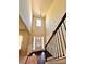 Grand foyer with soaring ceilings, hardwood floors, and a staircase with dark railings at 2269 Reddy Farm Ln, Grayson, GA 30017