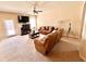 Cozy living room with comfortable leather seating and a ceiling fan at 2269 Reddy Farm Ln, Grayson, GA 30017