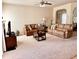 Open-concept living room featuring neutral tones, comfortable leather seating, and ample natural light at 2269 Reddy Farm Ln, Grayson, GA 30017