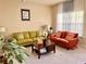 Comfortable living room with stylish sofas, a dark wood coffee table, and neutral decor at 2269 Reddy Farm Ln, Grayson, GA 30017
