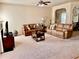 Spacious living room featuring arched doorways, neutral tones, and comfortable leather seating at 2269 Reddy Farm Ln, Grayson, GA 30017