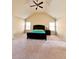 Spacious carpeted main bedroom with vaulted ceiling, windows, and a ceiling fan at 2269 Reddy Farm Ln, Grayson, GA 30017