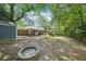 Large backyard featuring a fire pit, garden shed, and a spacious lawn at 2324 Bry Mar Ne Dr, Atlanta, GA 30345
