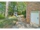 The backyard has a playhouse and a charming path leading to the brick house at 2324 Bry Mar Ne Dr, Atlanta, GA 30345
