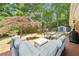 Inviting backyard patio with ample seating, dining table, garden shed and beautiful landscaping at 2324 Bry Mar Ne Dr, Atlanta, GA 30345
