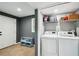 Basement laundry area with modern washer and dryer, plus storage space at 2324 Bry Mar Ne Dr, Atlanta, GA 30345