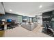 Finished basement with a cozy seating area, desk setup, and workout space at 2324 Bry Mar Ne Dr, Atlanta, GA 30345