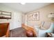 Bright Bedroom featuring hardwood floors, a crib, comfortable chair, and neutral decor at 2324 Bry Mar Ne Dr, Atlanta, GA 30345