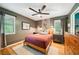Bedroom with neutral colors, hardwood floors, bedside tables, and a comfortable bed bathed in natural light at 2324 Bry Mar Ne Dr, Atlanta, GA 30345
