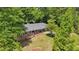 Aerial view of a charming brick home with mature trees and a well-maintained front yard at 2324 Bry Mar Ne Dr, Atlanta, GA 30345