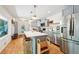 Bright kitchen featuring stainless steel appliances, gray cabinets, and a white quartz island with bar stool seating at 2324 Bry Mar Ne Dr, Atlanta, GA 30345
