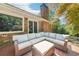 Spacious patio with outdoor seating and view of mature trees at 2324 Bry Mar Ne Dr, Atlanta, GA 30345