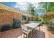 Brick patio featuring a dining area and a view of the lush backyard at 2324 Bry Mar Ne Dr, Atlanta, GA 30345