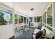 Screened porch area with outdoor seating and view of the backyard at 2324 Bry Mar Ne Dr, Atlanta, GA 30345