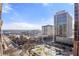 Wide city view from condo balcony, showcasing cityscape with buildings, trees and blue sky at 620 Peachtree Ne St # 1412, Atlanta, GA 30308