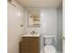 Stylish bathroom featuring a modern vanity with a horizontally-lined cabinet and an illuminated mirror at 620 Peachtree Ne St # 1412, Atlanta, GA 30308