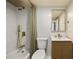 Chic bathroom featuring a shower/tub combination and a horizontally-lined vanity at 620 Peachtree Ne St # 1412, Atlanta, GA 30308
