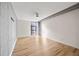 Spacious bedroom with wood floors, neutral walls and large window at 620 Peachtree Ne St # 1412, Atlanta, GA 30308