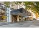 Property entrance showcasing a modern covered awning and a glass-walled lobby with comfortable seating at 620 Peachtree Ne St # 1412, Atlanta, GA 30308