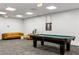 Well-lit game room with a pool table, cozy seating, and a relaxing atmosphere at 620 Peachtree Ne St # 1412, Atlanta, GA 30308