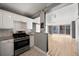 Open-concept kitchen featuring stainless steel appliances, granite countertops, with an opening to the living room at 620 Peachtree Ne St # 1412, Atlanta, GA 30308