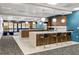 Modern kitchen in a community room, featuring bar stools, a long countertop and elegant pendant lighting at 620 Peachtree Ne St # 1412, Atlanta, GA 30308