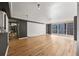 Open living room with hardwood floors and plenty of natural light from windows, with gray and white trim at 620 Peachtree Ne St # 1412, Atlanta, GA 30308