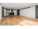 An open living room connected to the kitchen with hardwood floors and modern trim at 620 Peachtree Ne St # 1412, Atlanta, GA 30308