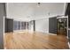 Spacious living room featuring hardwood floors, balcony access, and contrasting trim at 620 Peachtree Ne St # 1412, Atlanta, GA 30308