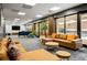 Comfortable lounge area featuring plush seating, modern tables, and views through large windows at 620 Peachtree Ne St # 1412, Atlanta, GA 30308