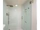 Elegant bathroom shower with a modern, rain-style shower head and tiled walls at 620 Peachtree Ne St # 1412, Atlanta, GA 30308