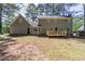 Back exterior of the house featuring a new wood deck at 714 Lanford Springs Sw Dr, Lilburn, GA 30047