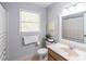 This bathroom features neutral paint, towels and a plant for decoration at 714 Lanford Springs Sw Dr, Lilburn, GA 30047