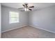 This bedroom has a ceiling fan, natural lighting, neutral carpet and is freshly painted at 714 Lanford Springs Sw Dr, Lilburn, GA 30047