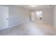Spacious bedroom with neutral carpet, two windows and two doors, one leading to the en suite bathroom at 714 Lanford Springs Sw Dr, Lilburn, GA 30047