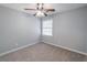 This bedroom has neutral carpet, natural lighting, a ceiling fan and is freshly painted at 714 Lanford Springs Sw Dr, Lilburn, GA 30047