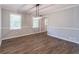 Dining room boasts vinyl floors, wainscoting, and modern lighting, creating an elegant space at 714 Lanford Springs Sw Dr, Lilburn, GA 30047