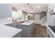 Modern kitchen with an island, white cabinets, and stainless steel appliances; eat-in area at 714 Lanford Springs Sw Dr, Lilburn, GA 30047