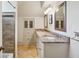 Bathroom boasting granite counters, double sinks, and custom-built storage at 8925 Huntcliff Lake Ct, Atlanta, GA 30350