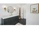 Stylish bathroom featuring a marble countertop, hexagon tile flooring, and elegant lighting fixtures at 8925 Huntcliff Lake Ct, Atlanta, GA 30350