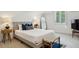 Bright bedroom with natural light, carpet, and bedside tables with lamps at 8925 Huntcliff Lake Ct, Atlanta, GA 30350