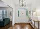 Bright foyer featuring a white door with sidelights and a decorative transom window at 8925 Huntcliff Lake Ct, Atlanta, GA 30350