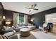 Sophisticated living room featuring dark walls, plush seating, and elegant lighting at 8925 Huntcliff Lake Ct, Atlanta, GA 30350
