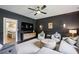 Stylish living room featuring a dark wall, accent lighting, and an open doorway to kitchen at 8925 Huntcliff Lake Ct, Atlanta, GA 30350