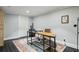 Office space with a rustic desk, modern computer setup, and tile flooring at 8925 Huntcliff Lake Ct, Atlanta, GA 30350