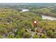 Aerial view of home and neighborhood with lake in distance at 107 Estates At The Lake Dr, Canton, GA 30114