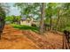 Backyard with a well-manicured lawn and deck with stairs at 107 Estates At The Lake Dr, Canton, GA 30114