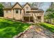 Spacious backyard with a deck and patio, lush lawn and stone walkway at 107 Estates At The Lake Dr, Canton, GA 30114