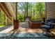 Backyard patio with a brick planter, leading to the storage shed, surrounded by green trees at 107 Estates At The Lake Dr, Canton, GA 30114